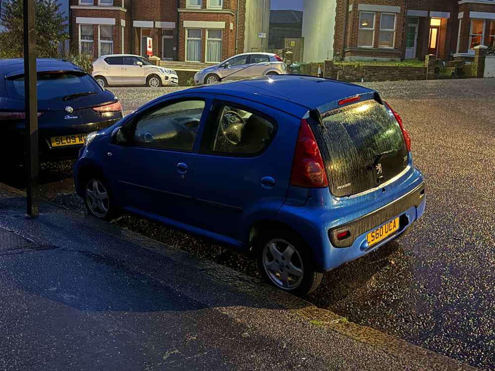 Photograph of LS60 UCA - a Blue Peugeot 107 parked in Hollingdean by a non-resident. The twenty-ninth of twenty-nine photographs supplied by the residents of Hollingdean.
