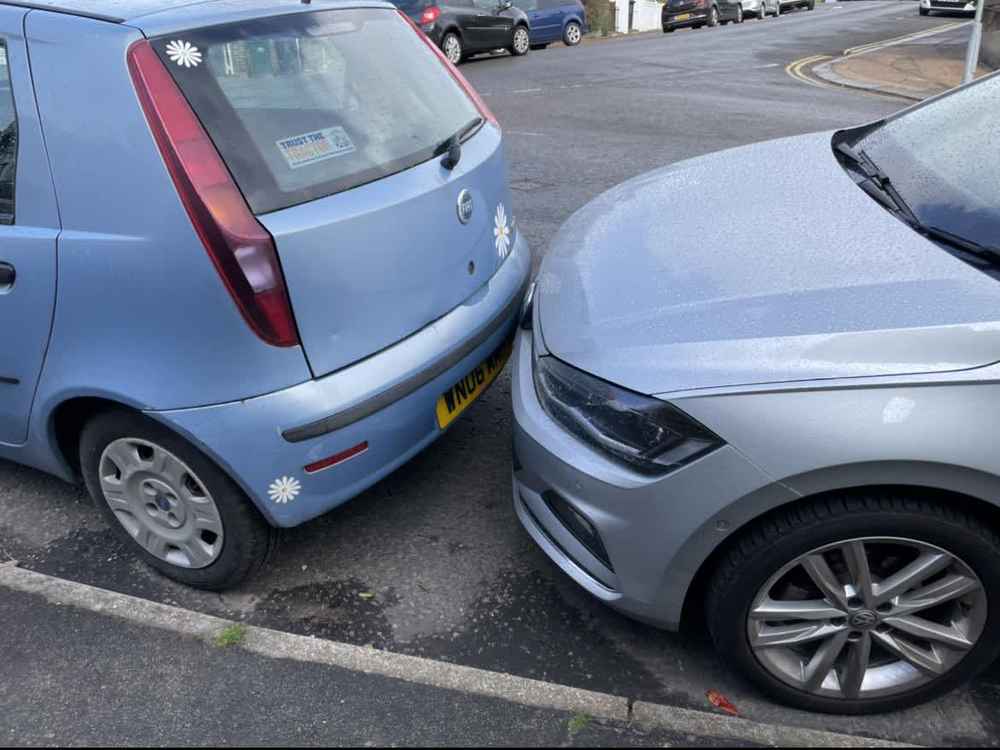 Photograph of WN06 MMF - a Blue Fiat Punto parked in Hollingdean by a non-resident. The first of three photographs supplied by the residents of Hollingdean.