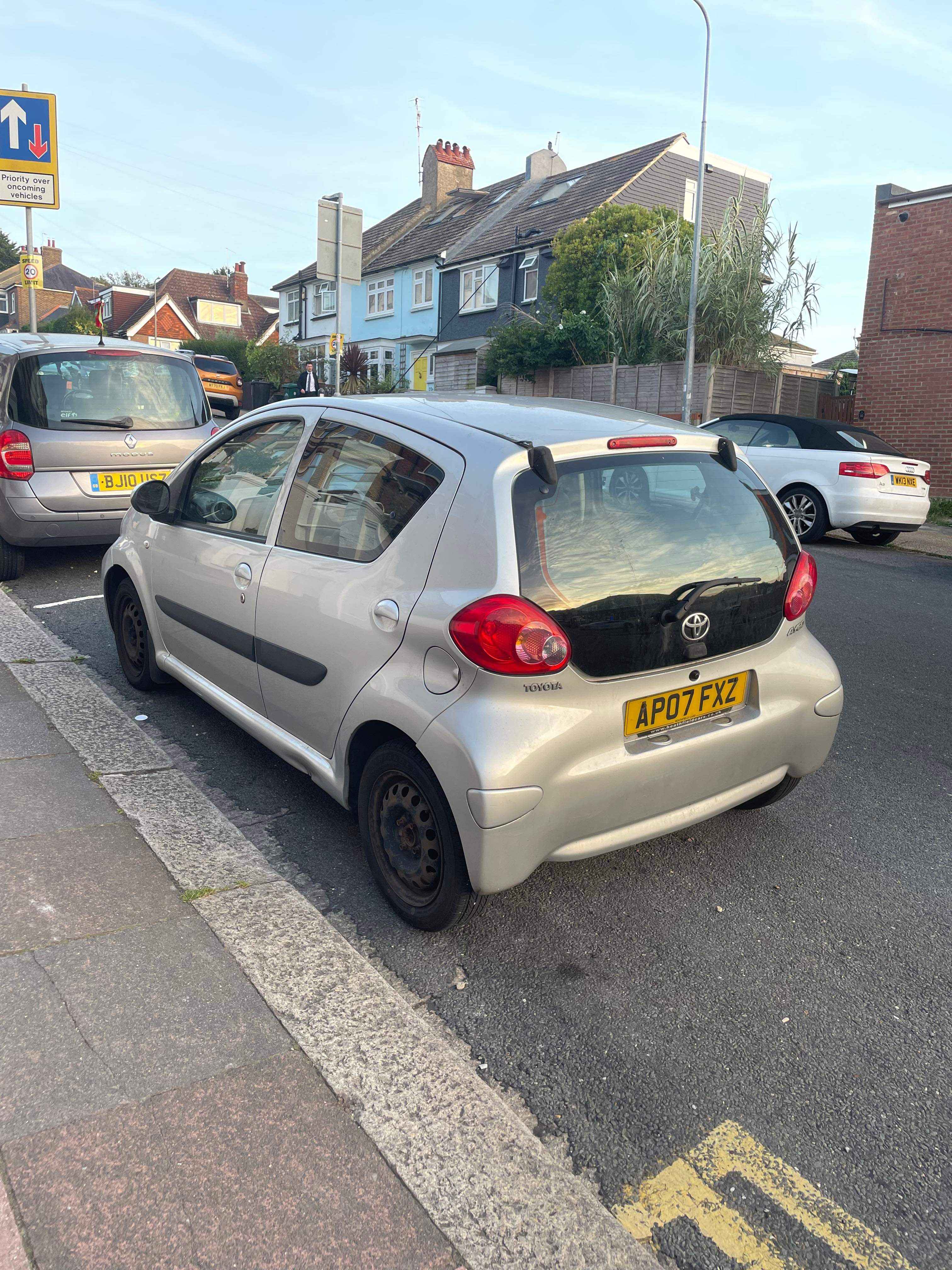 Photograph of AP07 FXZ - a Silver Toyota Aygo parked in Hollingdean by a non-resident, and potentially abandoned. The third of three photographs supplied by the residents of Hollingdean.