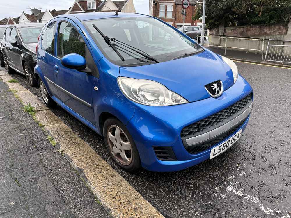 Photograph of LS60 UCA - a Blue Peugeot 107 parked in Hollingdean by a non-resident. The first of thirteen photographs supplied by the residents of Hollingdean.
