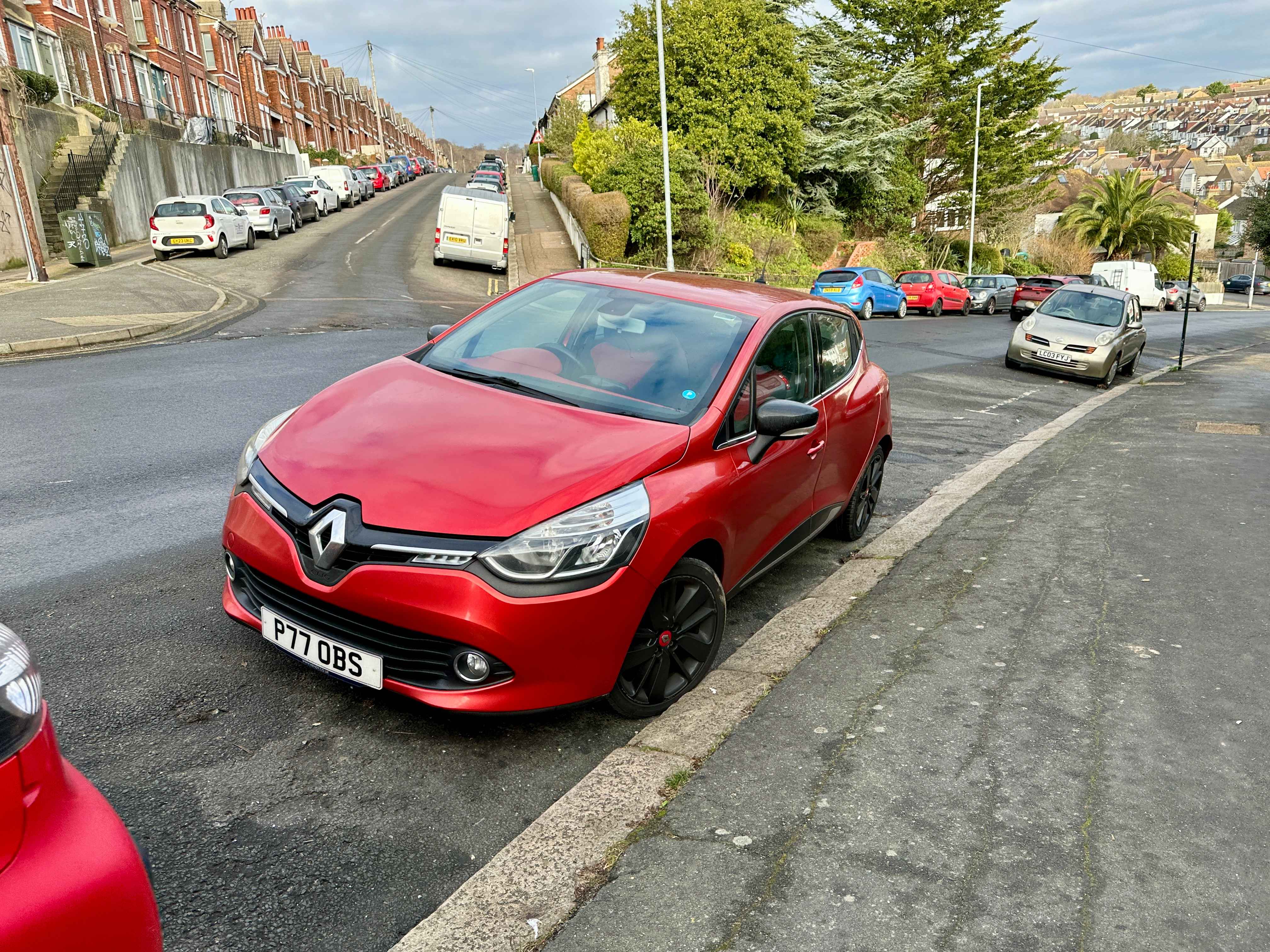 Photograph of P77 OBS - a Red Renault Clio parked in Hollingdean by a non-resident. The fourth of four photographs supplied by the residents of Hollingdean.
