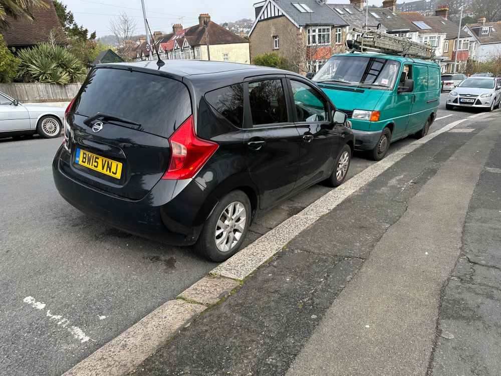 Photograph of BW15 VNJ - a Black Nissan Note parked in Hollingdean by a non-resident who uses the local area as part of their Brighton commute. The seventeenth of twenty photographs supplied by the residents of Hollingdean.