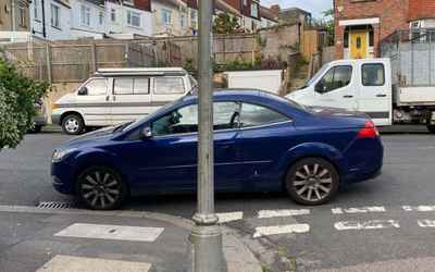 PJ58 OEY, a Blue Ford Focus parked in Hollingdean