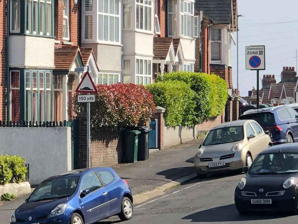 Photograph of LC03 FYJ - a Gold Nissan Micra parked in Hollingdean by a non-resident, and potentially abandoned. The first of twenty-eight photographs supplied by the residents of Hollingdean.