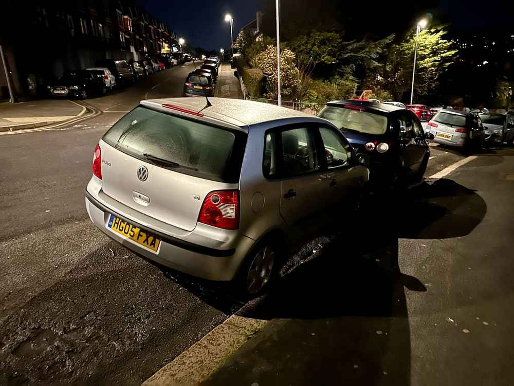 Photograph of HG05 FXA - a Silver Volkwsagen Polo parked in Hollingdean by a non-resident, and potentially abandoned. The second of three photographs supplied by the residents of Hollingdean.