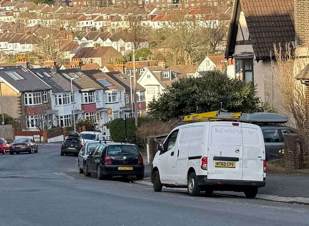 Photograph of MT60 CPE - a White Nissan NV200 parked in Hollingdean by a non-resident, and potentially abandoned. The second of fourteen photographs supplied by the residents of Hollingdean.
