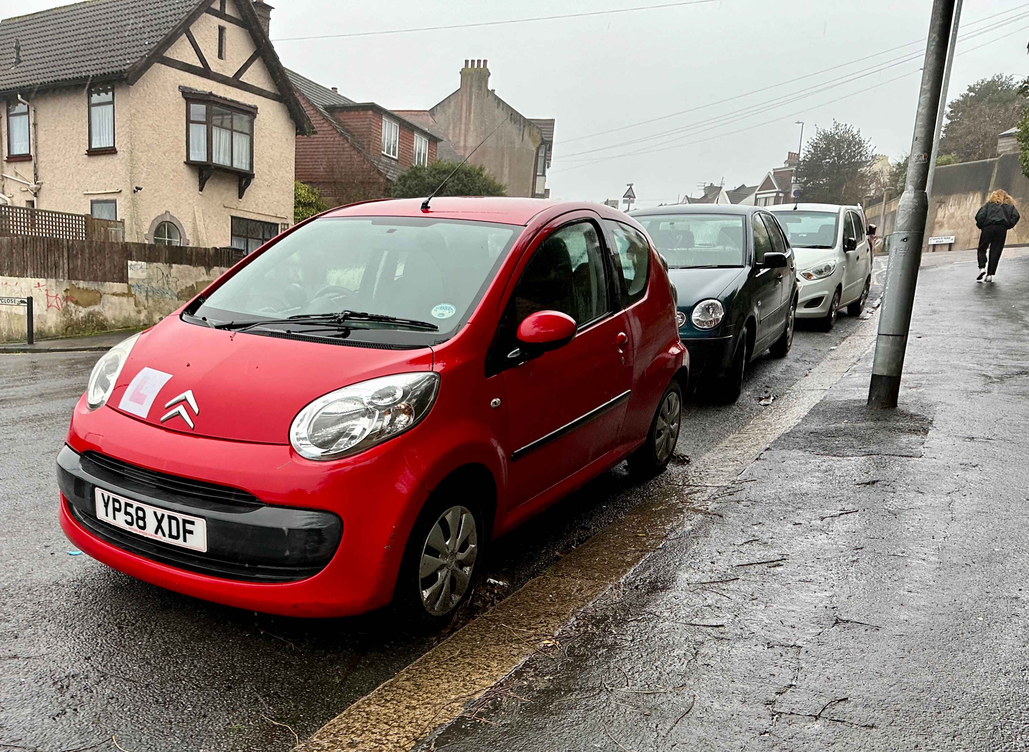 Photograph of YP58 XDF - a Red Citroen C1 parked in Hollingdean by a non-resident, and potentially abandoned. The second of five photographs supplied by the residents of Hollingdean.
