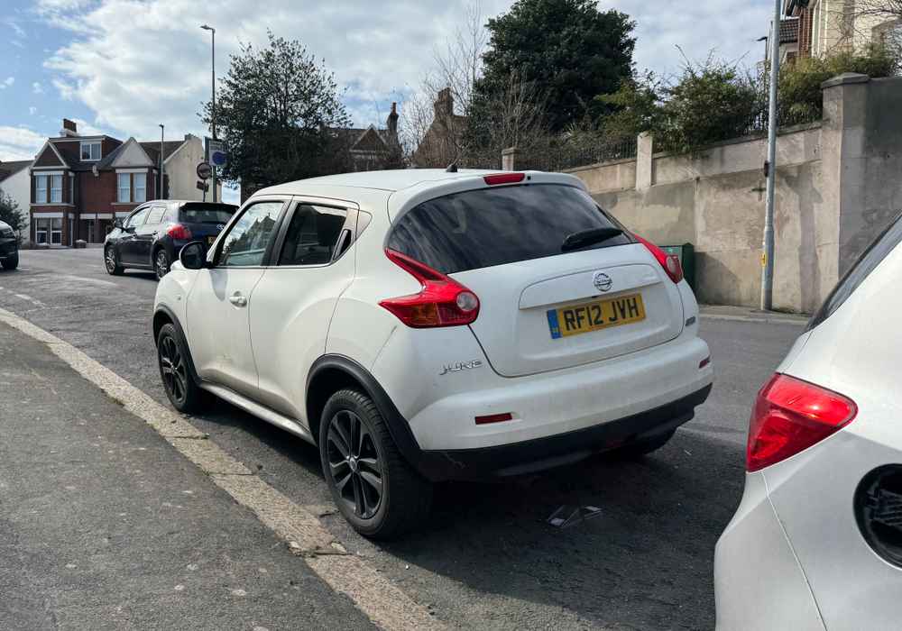 Photograph of RF12 JVH - a White Nissan Juke parked in Hollingdean by a non-resident who uses the local area as part of their Brighton commute. The thirteenth of thirteen photographs supplied by the residents of Hollingdean.