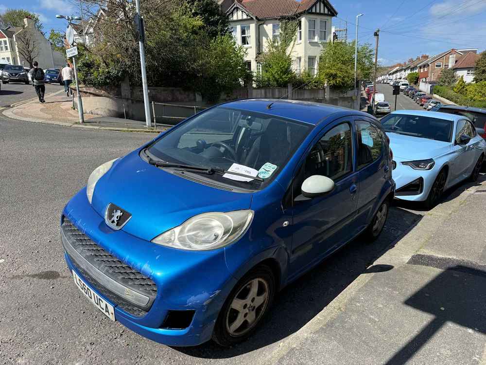 Photograph of LS60 UCA - a Blue Peugeot 107 parked in Hollingdean by a non-resident. The thirty-second of thirty-two photographs supplied by the residents of Hollingdean.