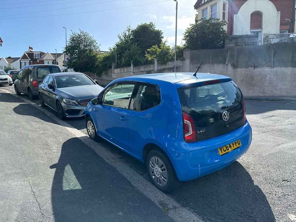 Photograph of YC64 FUU - a Blue VOlkswagen Up parked in Hollingdean by a non-resident. The third of seven photographs supplied by the residents of Hollingdean.