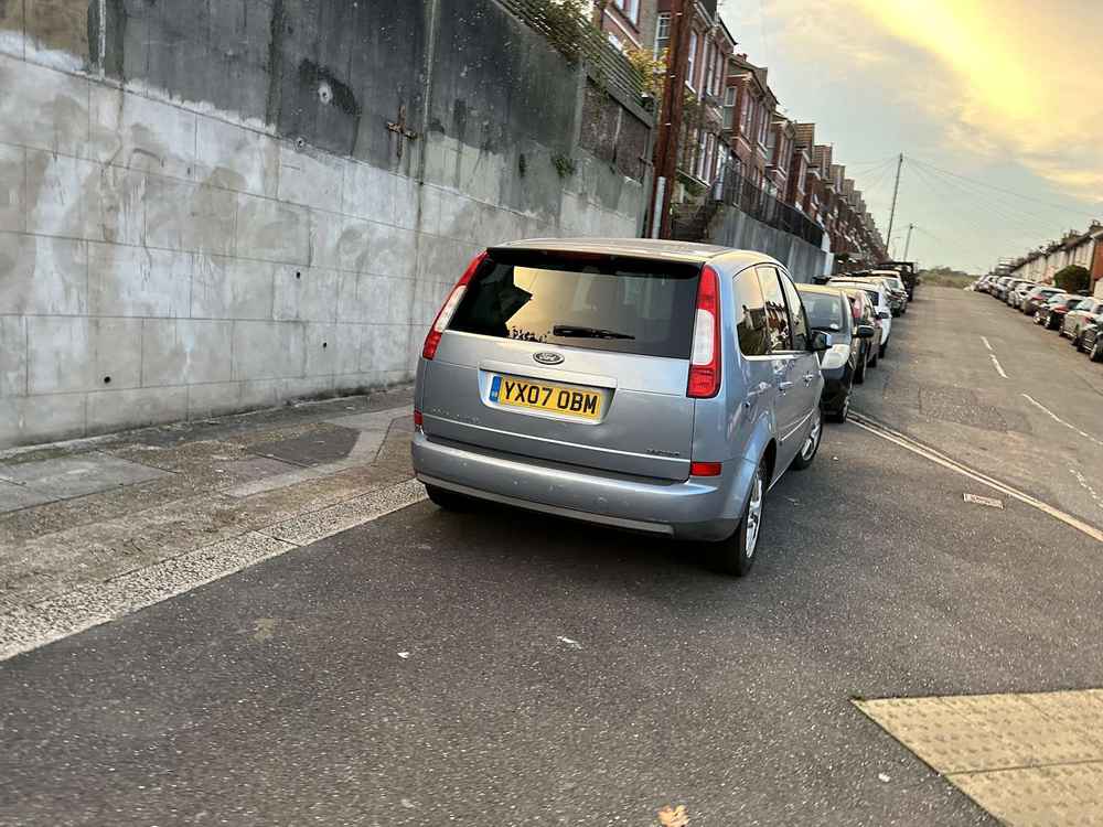 Photograph of YX07 OBM - a Silver Ford Focus C-Max parked in Hollingdean by a non-resident. The second of four photographs supplied by the residents of Hollingdean.