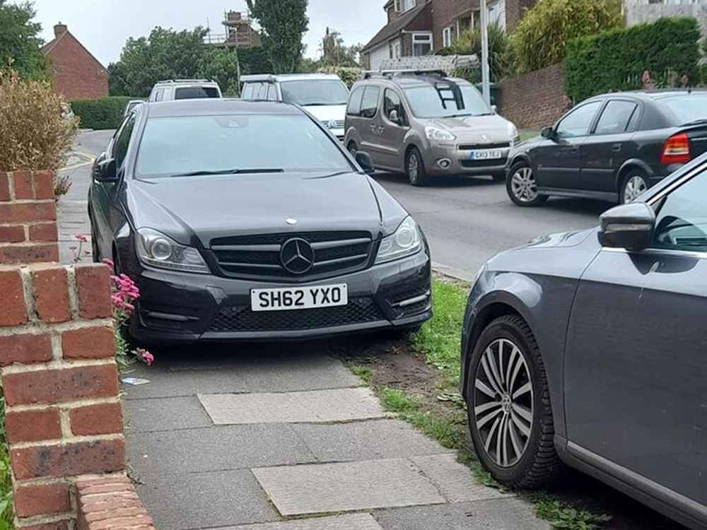 Photograph of SH62 YXO - a Black Mercedes C Class parked in Hollingdean. 