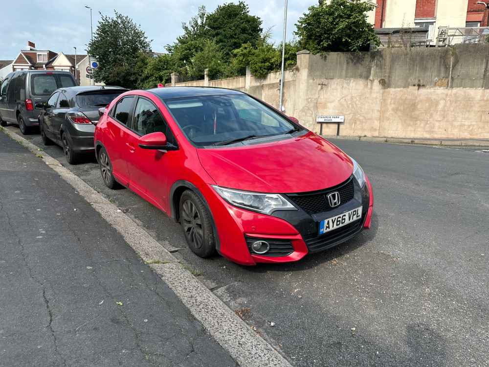 Photograph of AY66 VPL - a Red Honda Civic parked in Hollingdean by a non-resident. The second of five photographs supplied by the residents of Hollingdean.