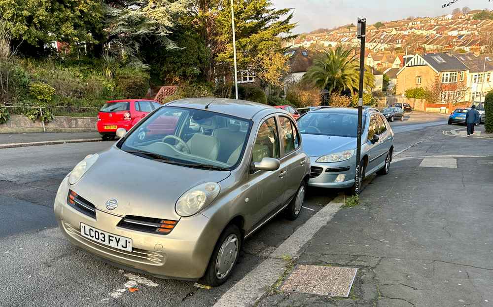 Photograph of LC03 FYJ - a Gold Nissan Micra parked in Hollingdean by a non-resident, and potentially abandoned. The tenth of twenty-three photographs supplied by the residents of Hollingdean.