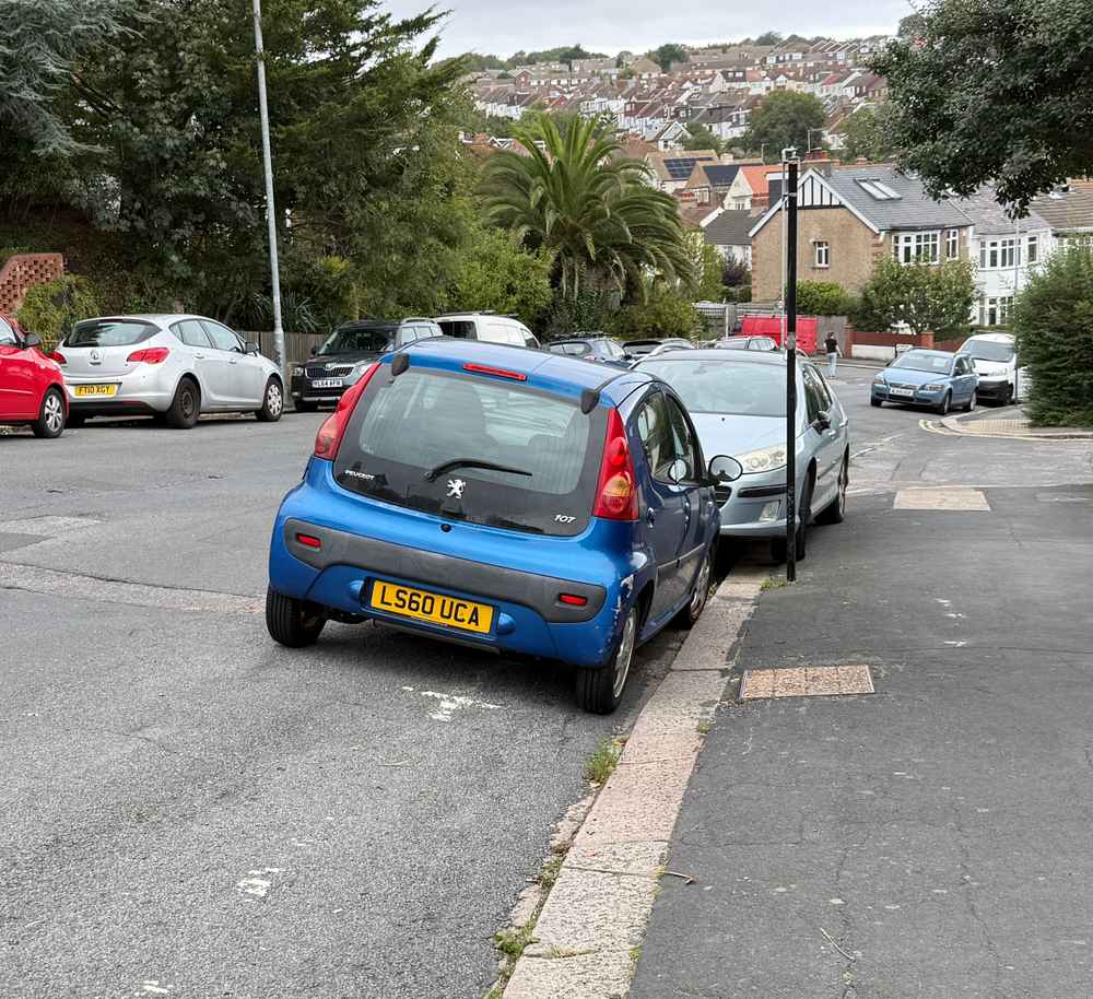 Photograph of LS60 UCA - a Blue Peugeot 107 parked in Hollingdean by a non-resident. The twenty-sixth of twenty-seven photographs supplied by the residents of Hollingdean.