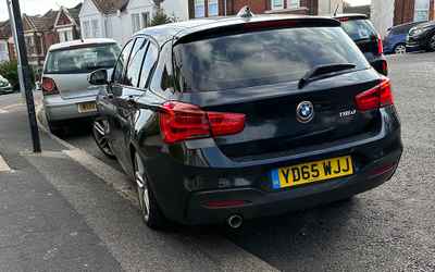 YD65 WJJ, a Black BMW 1 Series parked in Hollingdean