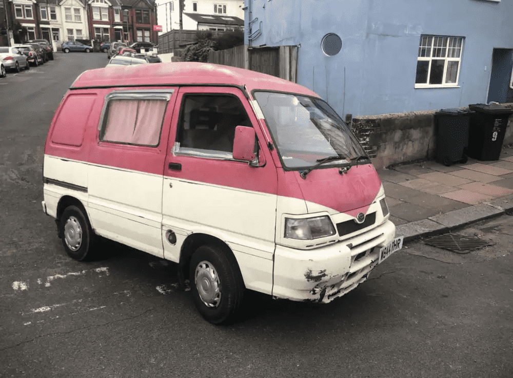 Photograph of W844 RHR - a Pink Daihatsu Hijet camper van parked in Hollingdean by a non-resident, and potentially abandoned. The first of three photographs supplied by the residents of Hollingdean.