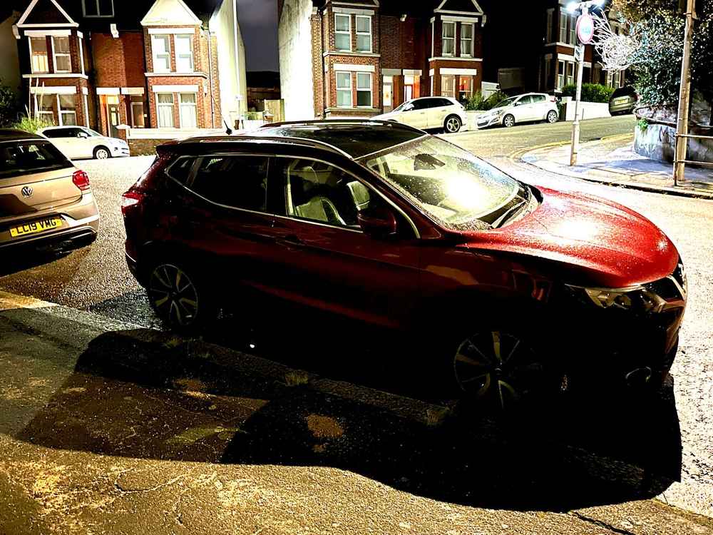 Photograph of GV17 ZWE - a Red Nissan Qashqai parked in Hollingdean by a non-resident. The third of four photographs supplied by the residents of Hollingdean.