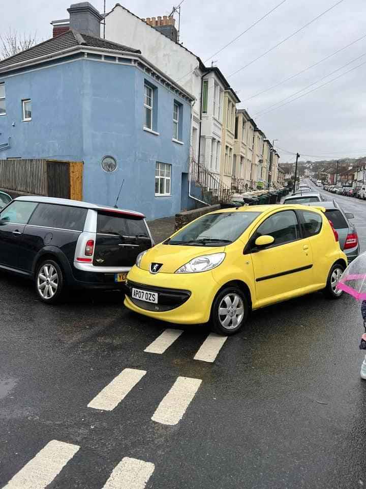 Photograph of AP07 OZS - a Yellow Peugeot 107 parked in Hollingdean by a non-resident who uses the local area as part of their Brighton commute. The second of two photographs supplied by the residents of Hollingdean.