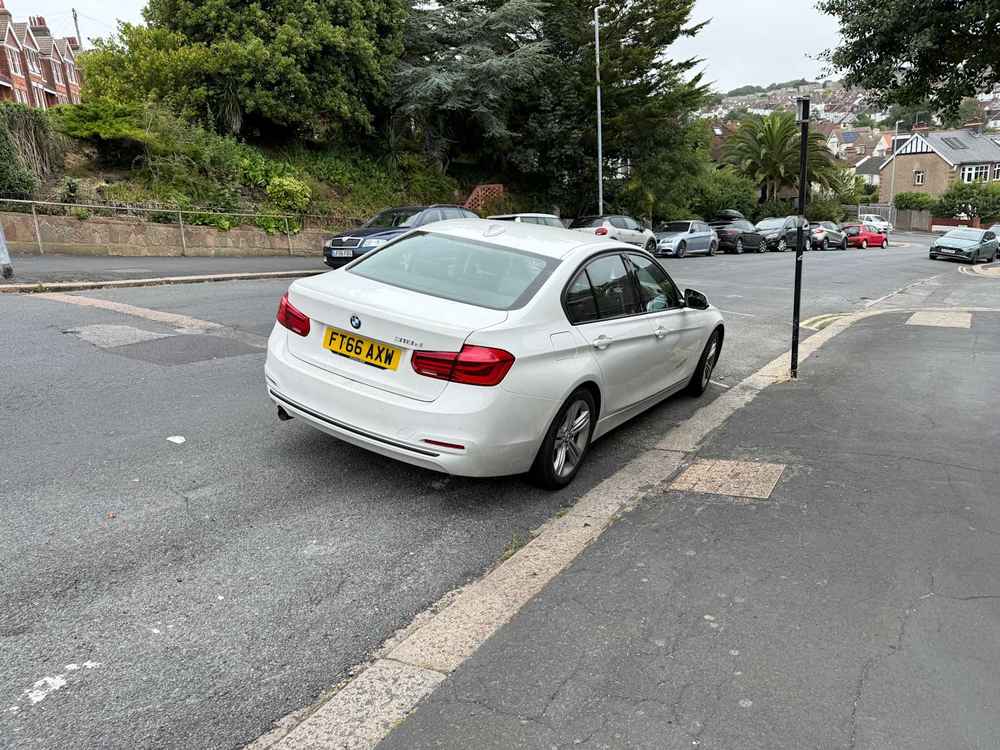 Photograph of FT66 AXW - a White BMW 3 Series parked in Hollingdean by a non-resident who uses the local area as part of their Brighton commute. The nineteenth of twenty-five photographs supplied by the residents of Hollingdean.
