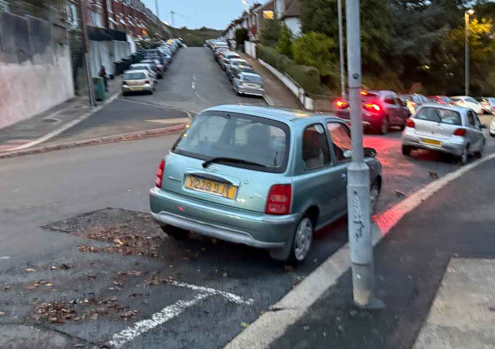 Photograph of Y228 DJT - a Green Nissan Micra parked in Hollingdean by a non-resident, and potentially abandoned. The eighth of eight photographs supplied by the residents of Hollingdean.