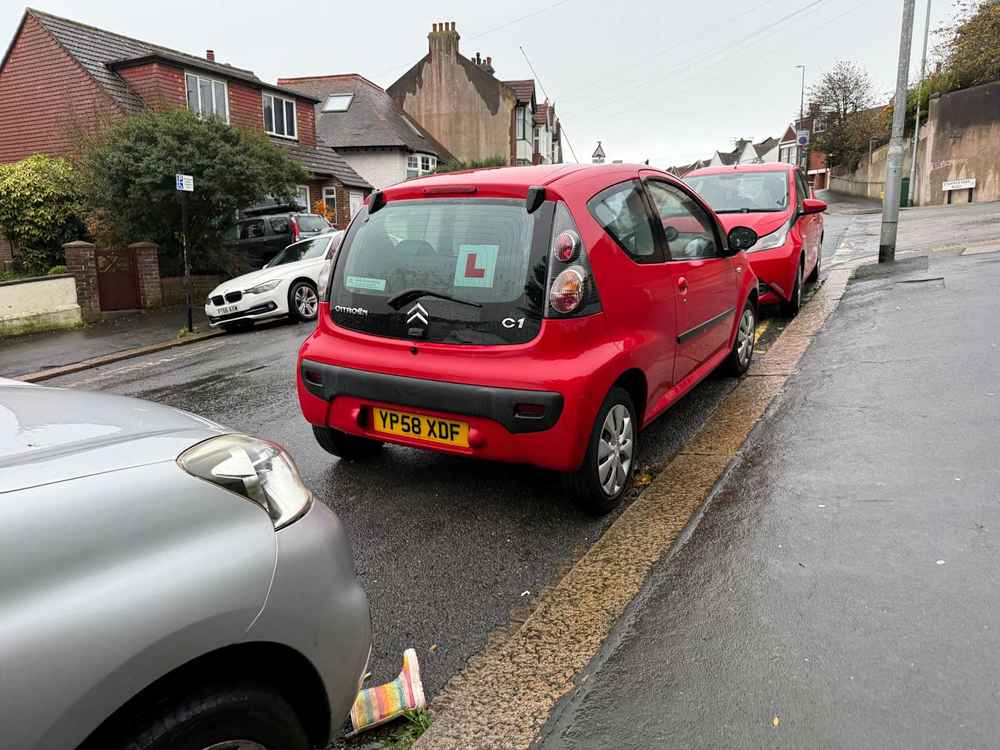 Photograph of YP58 XDF - a Red Citroen C1 parked in Hollingdean by a non-resident, and potentially abandoned. The eighteenth of twenty photographs supplied by the residents of Hollingdean.