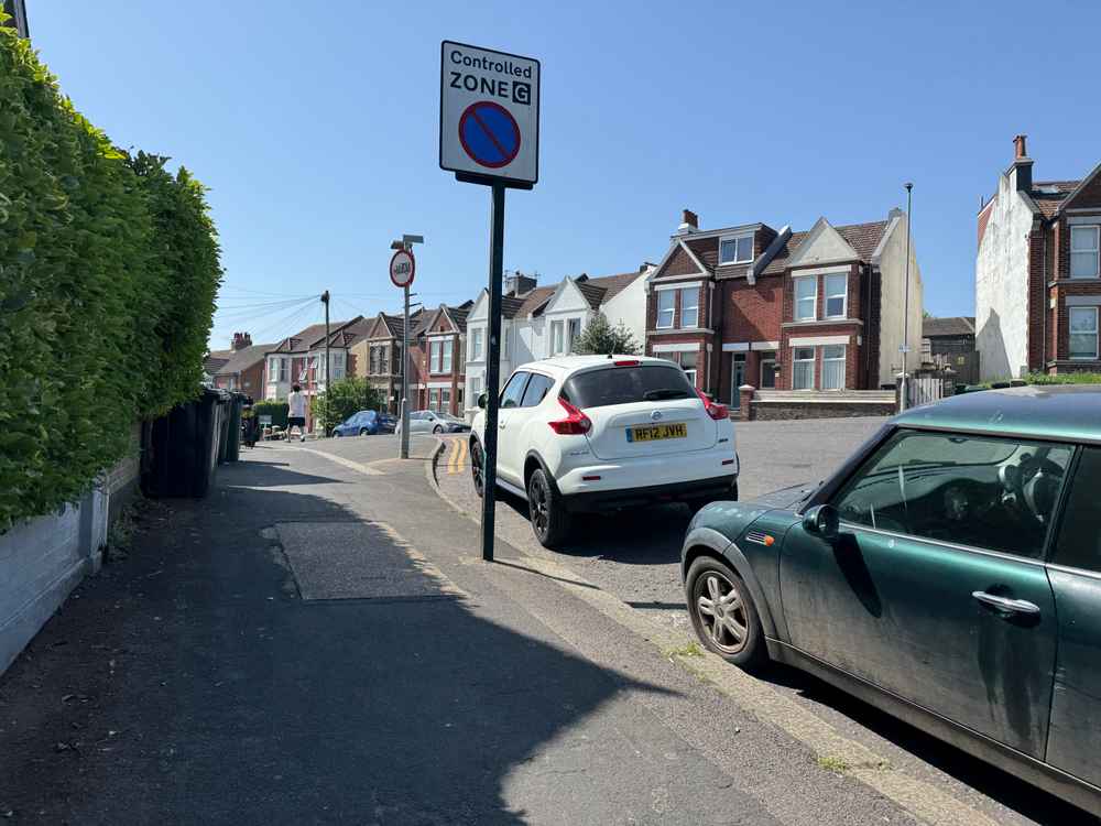 Photograph of RF12 JVH - a White Nissan Juke parked in Hollingdean by a non-resident who uses the local area as part of their Brighton commute. The fourteenth of fourteen photographs supplied by the residents of Hollingdean.