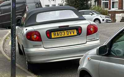 RA03 DVV, a Silver Renault Megane parked in Hollingdean