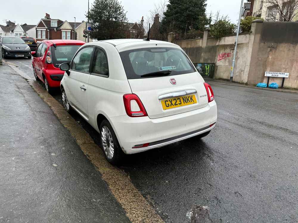 Photograph of GX23 NKK - a White Fiat 500 parked in Hollingdean by a non-resident who uses the local area as part of their Brighton commute. The second of three photographs supplied by the residents of Hollingdean.