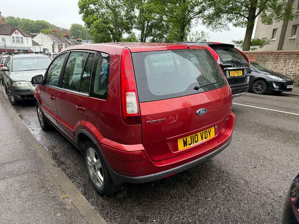 Photograph of WJ10 VDY - a Red Ford Fusion parked in Hollingdean by a non-resident. The second of five photographs supplied by the residents of Hollingdean.