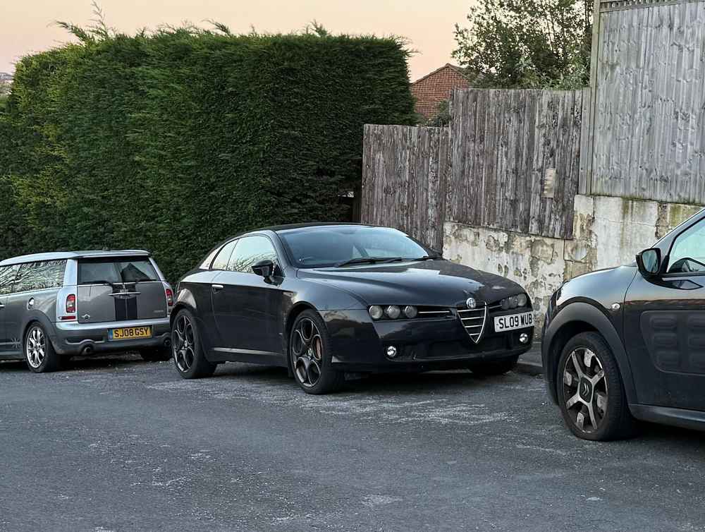 Photograph of SL09 WUB - a Black Alfa Romeo Brera parked in Hollingdean by a non-resident. The forty-second of forty-six photographs supplied by the residents of Hollingdean.