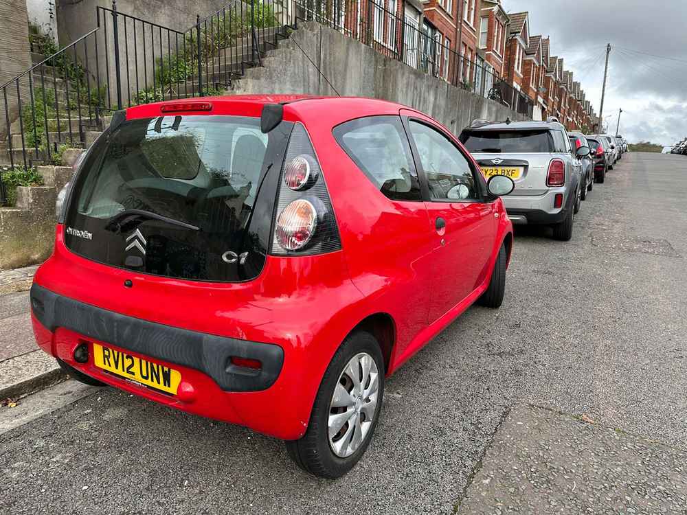 Photograph of RV12 UNW - a Red Citroen C1 parked in Hollingdean by a non-resident. The third of four photographs supplied by the residents of Hollingdean.