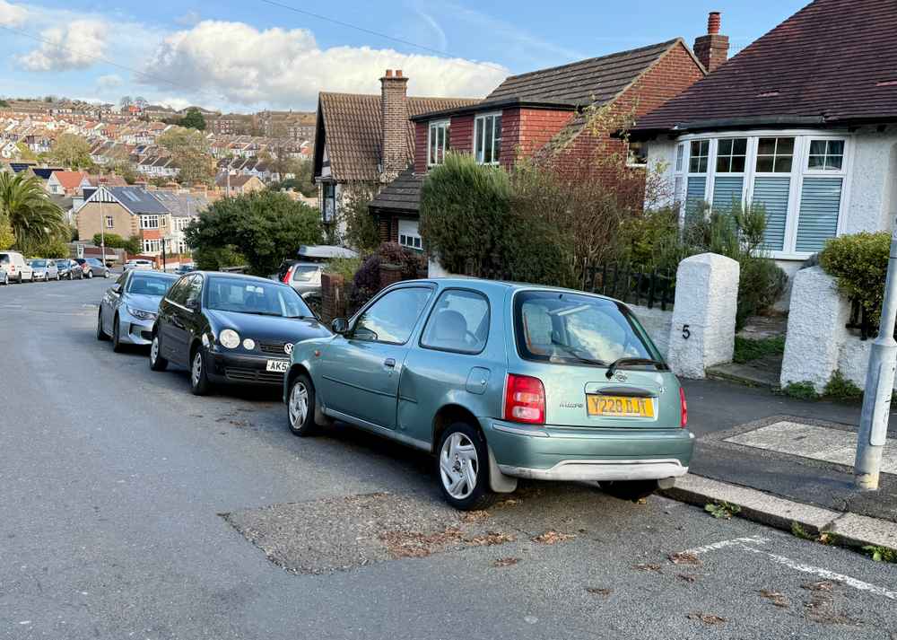 Photograph of Y228 DJT - a Green Nissan Micra parked in Hollingdean by a non-resident, and potentially abandoned. The eighth of nine photographs supplied by the residents of Hollingdean.