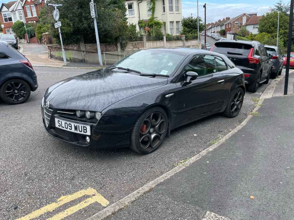 Photograph of SL09 WUB - a Black Alfa Romeo Brera parked in Hollingdean by a non-resident. The seventh of twenty-six photographs supplied by the residents of Hollingdean.