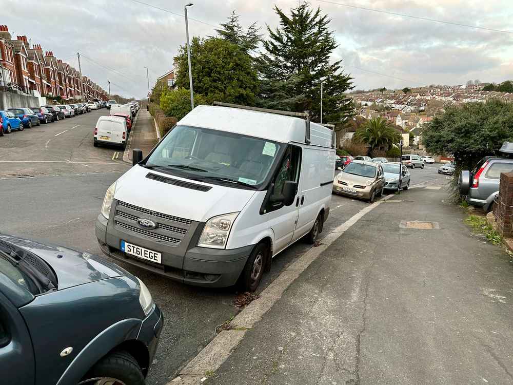 Photograph of ST61 EGE - a White Ford Transit parked in Hollingdean by a non-resident. The sixth of six photographs supplied by the residents of Hollingdean.