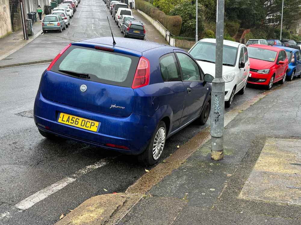 Photograph of LA56 OCP - a Blue Fiat Punto parked in Hollingdean by a non-resident, and potentially abandoned. The second of six photographs supplied by the residents of Hollingdean.