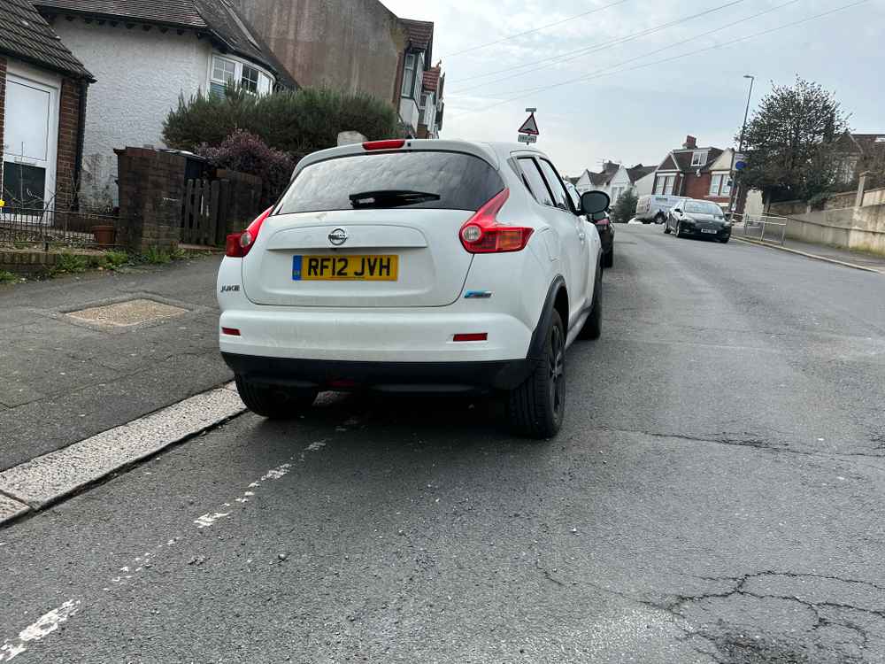 Photograph of RF12 JVH - a White Nissan Juke parked in Hollingdean by a non-resident who uses the local area as part of their Brighton commute. The fourth of eight photographs supplied by the residents of Hollingdean.
