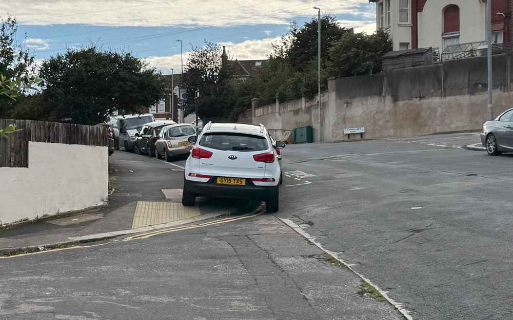 Photograph of GY15 TXS - a White Kia Sportage parked in Hollingdean by a non-resident. The first of two photographs supplied by the residents of Hollingdean.