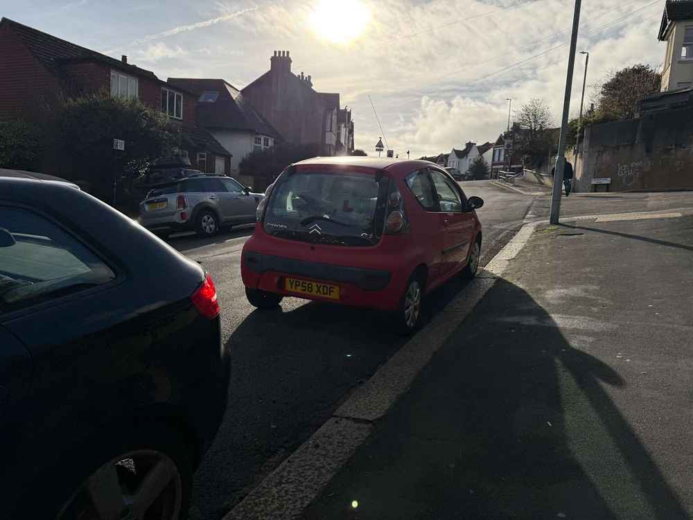Photograph of YP58 XDF - a Red Citroen C1 parked in Hollingdean by a non-resident, and potentially abandoned. The twentieth of twenty photographs supplied by the residents of Hollingdean.