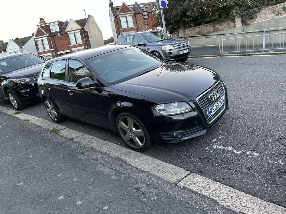 Photograph of RE09 DOU - a Black Audi A3 parked in Hollingdean by a non-resident who uses the local area as part of their Brighton commute. The second of eleven photographs supplied by the residents of Hollingdean.