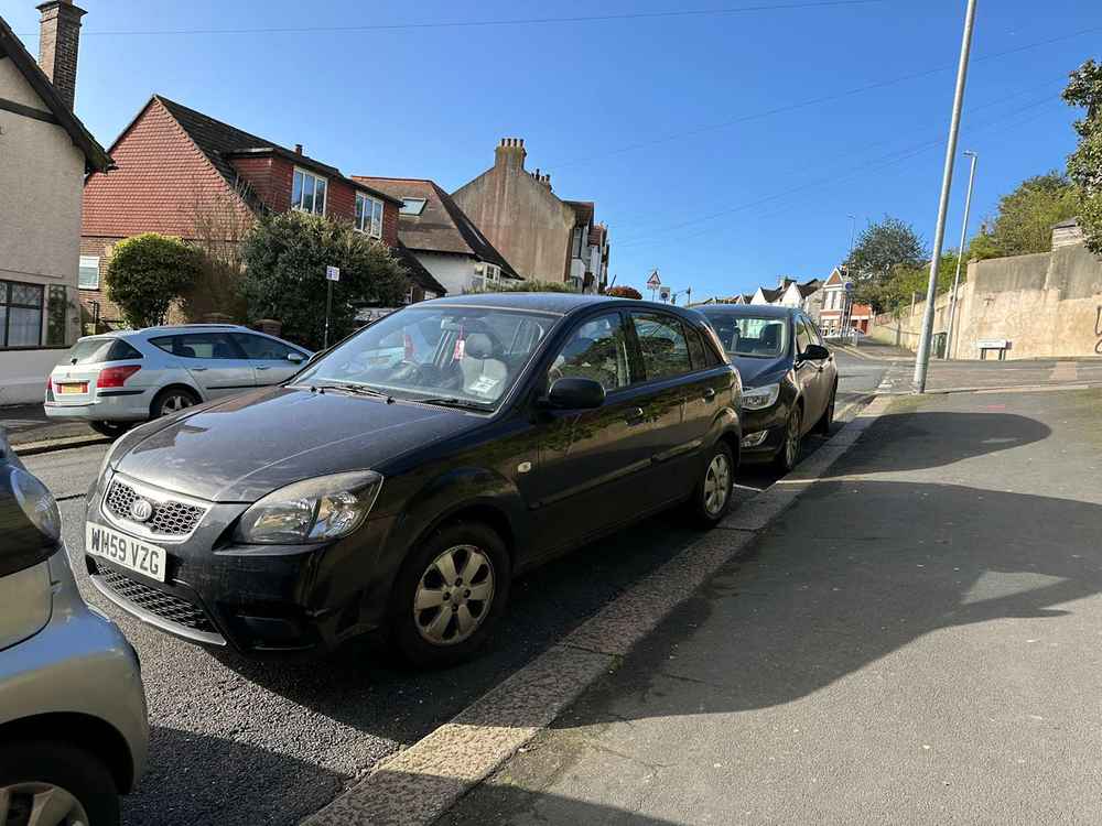 Photograph of WM59 VZG - a Black Kia Rio parked in Hollingdean by a non-resident. The sixth of nine photographs supplied by the residents of Hollingdean.