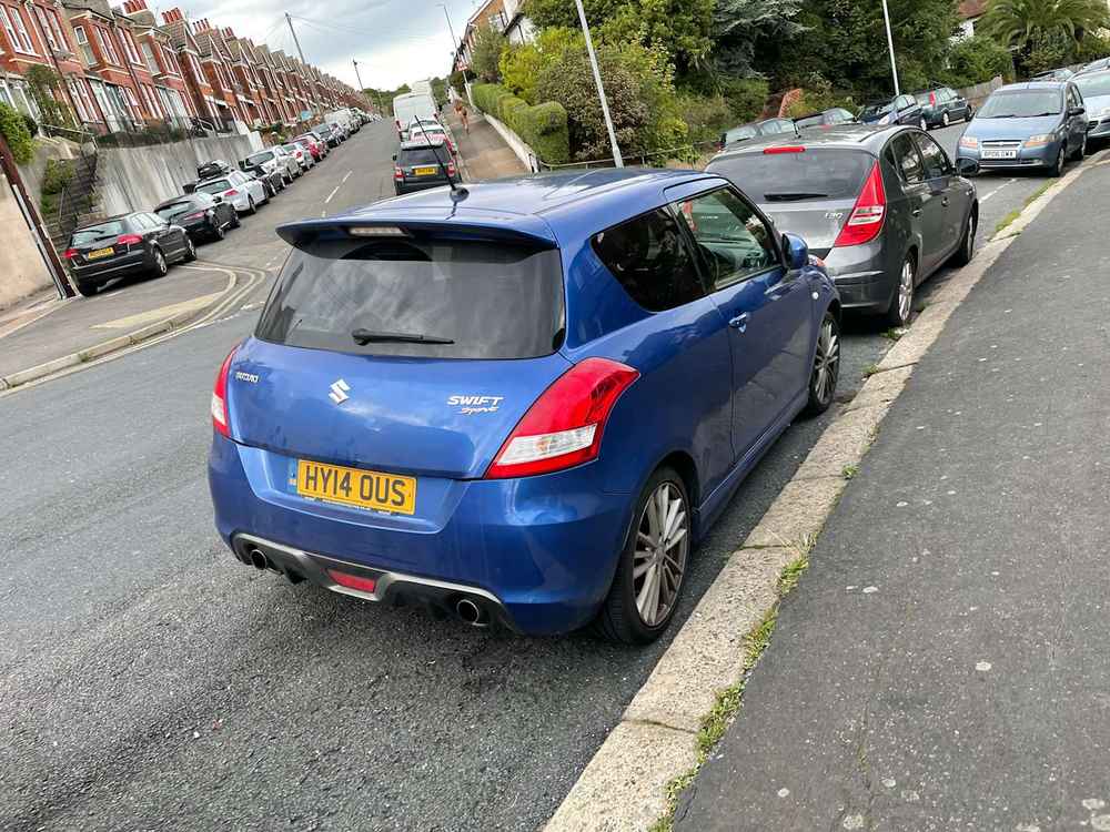 Photograph of HY14 OUS - a Blue Suzuki Swift parked in Hollingdean by a non-resident. The first of four photographs supplied by the residents of Hollingdean.
