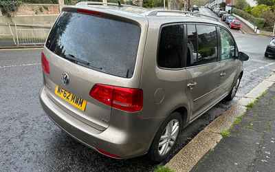 WF62 MWM, a Gold Volkswagen Touran parked in Hollingdean