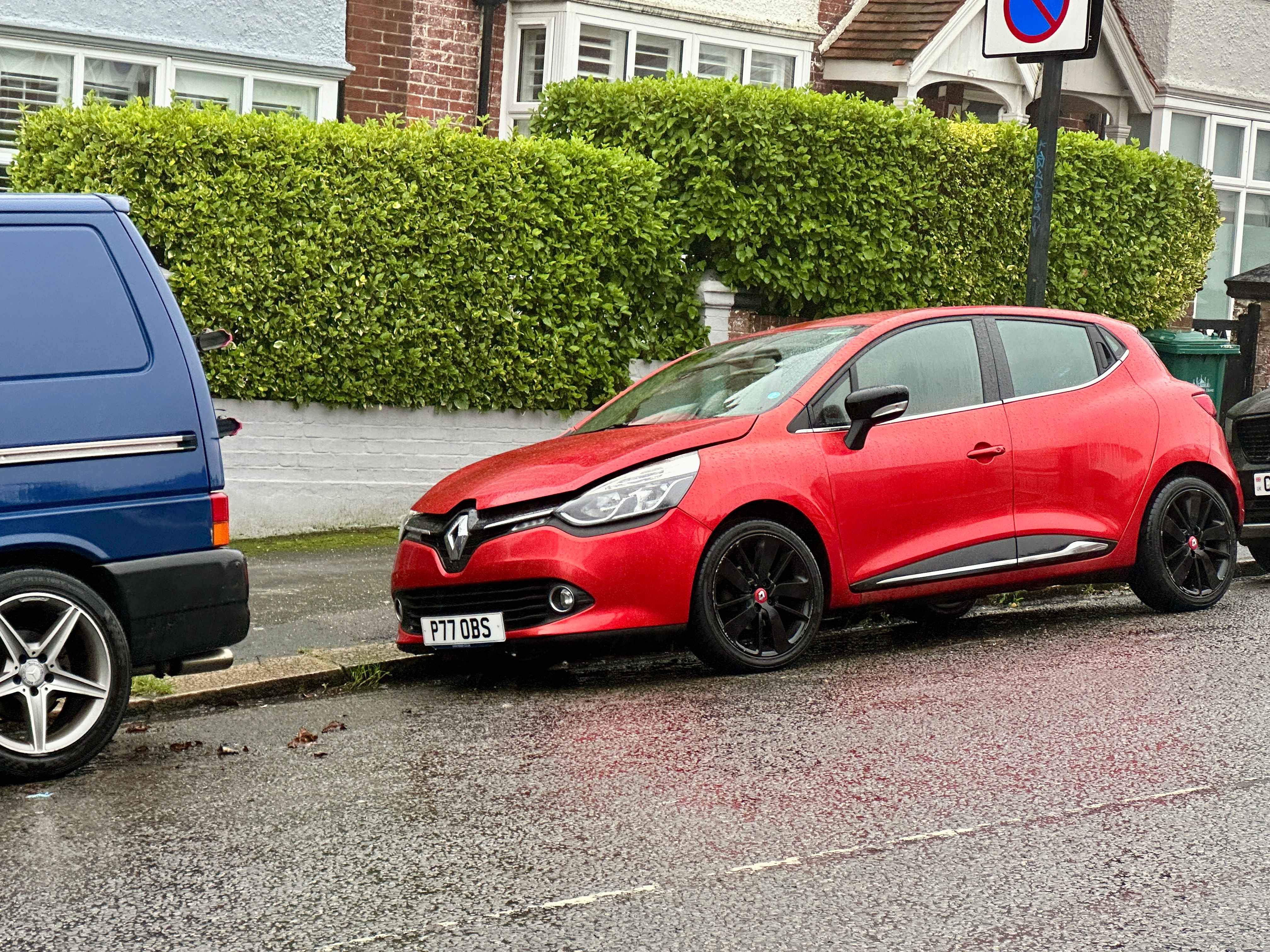 Photograph of P77 OBS - a Red Renault Clio parked in Hollingdean by a non-resident. The third of four photographs supplied by the residents of Hollingdean.
