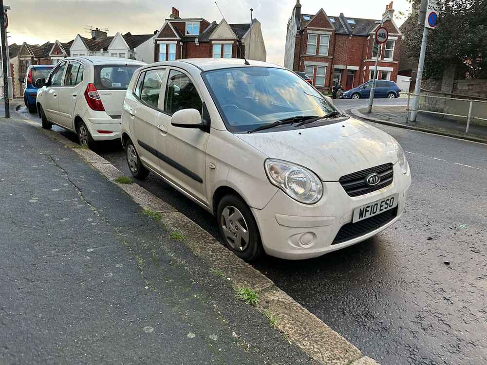 Photograph of WF10 ESO - a White Kia Picanto parked in Hollingdean by a non-resident. 