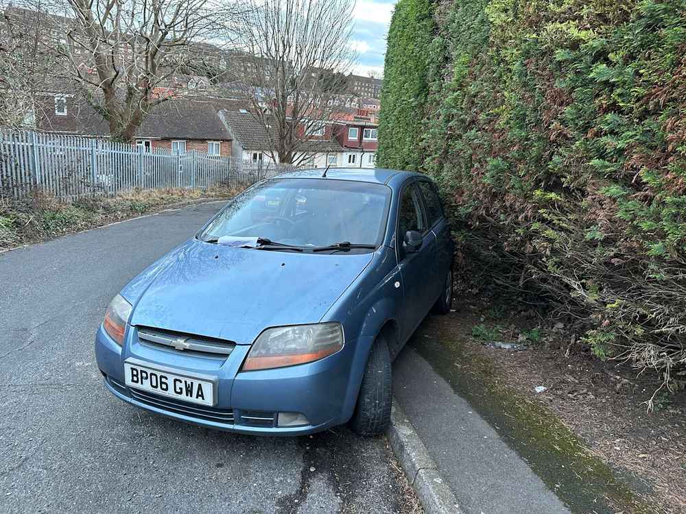 Photograph of BP06 GWA - a Blue Chevrolet Kalos parked in Hollingdean by a non-resident, and potentially abandoned. The first of two photographs supplied by the residents of Hollingdean.