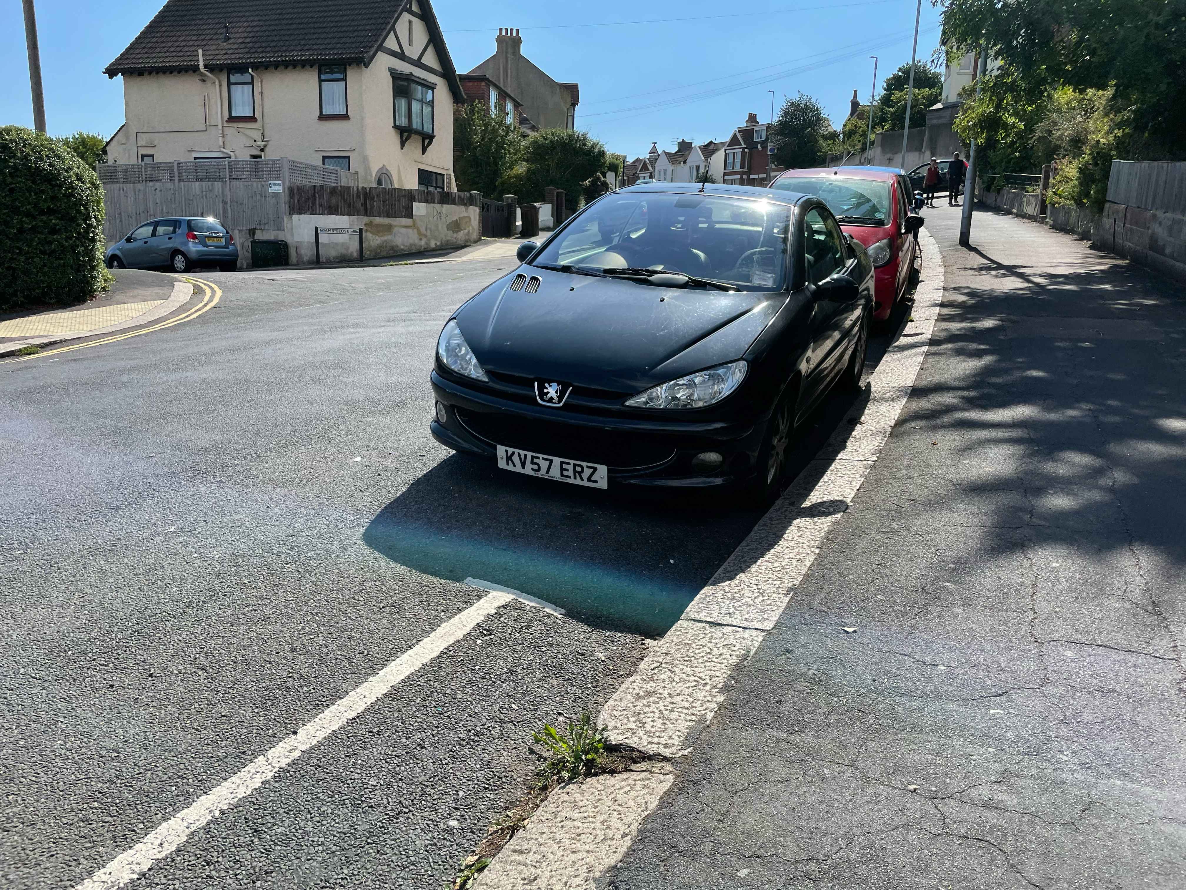 Photograph of KV57 ERZ - a Black Peugeot 206 parked in Hollingdean by a non-resident. The third of eight photographs supplied by the residents of Hollingdean.