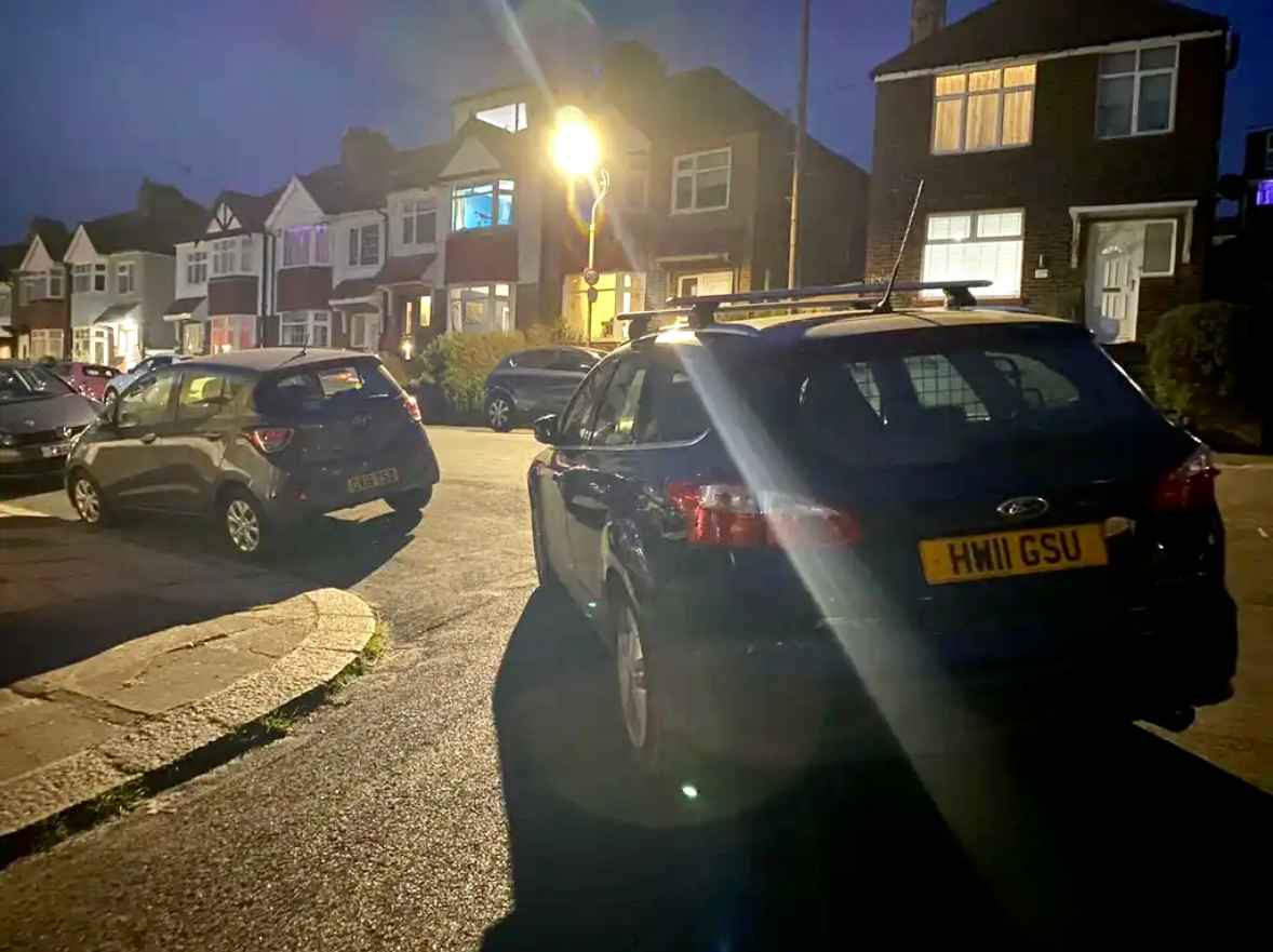 Photograph of HW11 GSU - a Blue Ford Focus parked in Hollingdean. The first of three photographs supplied by the residents of Hollingdean.