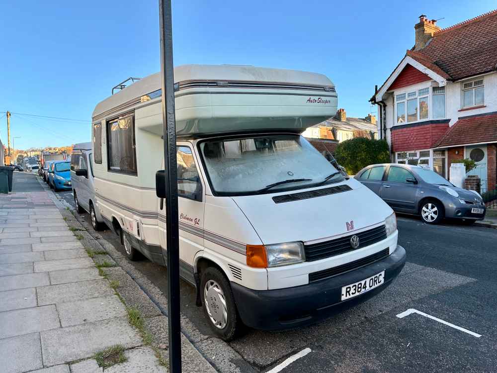 Photograph of R384 ORC - a Beige Volkswagen Transporter camper van parked in Hollingdean by a non-resident, and potentially abandoned. The seventh of thirteen photographs supplied by the residents of Hollingdean.