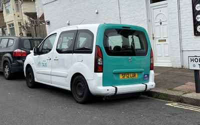 SF12 LUR, a White Peugeot Partner parked in Hollingdean